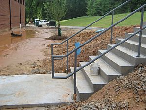 ADA steel railings for concrete stairs. 1 1/4 inch (1.5/8 inch OD) steel pipe railings