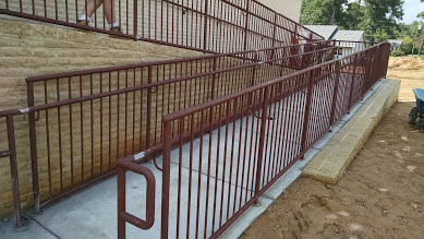 griprails welded onto steel ramp guardrails