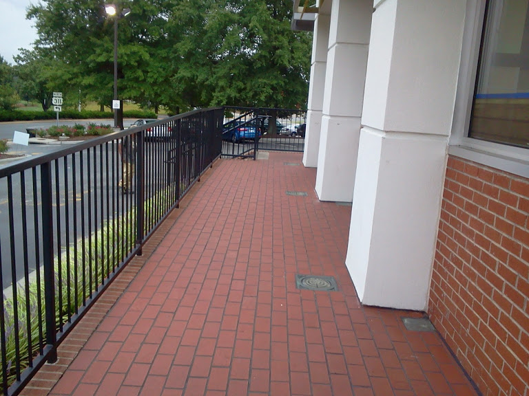 Strait run steel railings with core drilled installation and set in bricks.